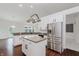 Well-appointed kitchen featuring stainless steel appliances, granite countertops, and a convenient center island at 14332 Eddington Pl, Fishers, IN 46037