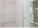 Walk-in closet featuring carpeted flooring and wire shelving for ample storage and organization at 14332 Eddington Pl, Fishers, IN 46037