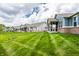 A manicured backyard, screened in patio and partial exterior elevation define the property at 19009 Beverly Shones Ln, Noblesville, IN 46062