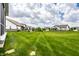 A large backyard, manicured lawn and partial exterior elevation define the property at 19009 Beverly Shones Ln, Noblesville, IN 46062