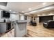 Finished basement with a wet bar, movie posters, recessed lights, and a black accent wall at 19009 Beverly Shones Ln, Noblesville, IN 46062