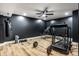 Finished basement featuring wood flooring, a ceiling fan, and workout equipment at 19009 Beverly Shones Ln, Noblesville, IN 46062