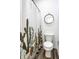 Stylish bathroom with a unique cactus-themed shower curtain and a round decorative mirror at 19009 Beverly Shones Ln, Noblesville, IN 46062