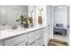 Bright bathroom featuring a double sink vanity with quartz countertops and modern fixtures at 19009 Beverly Shones Ln, Noblesville, IN 46062