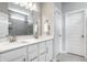 Sleek bathroom featuring a double vanity with white quartz countertops and contemporary fixtures at 19009 Beverly Shones Ln, Noblesville, IN 46062