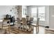 Dining room with a rustic wooden table and six upholstered chairs at 19009 Beverly Shones Ln, Noblesville, IN 46062