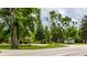 Picturesque roadside view featuring a cozy house, lush greenery, and colorful canoes, ideal for outdoor enthusiasts at 19009 Beverly Shones Ln, Noblesville, IN 46062