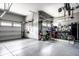 Spacious garage with epoxy flooring and ample storage space for vehicles and equipment at 19009 Beverly Shones Ln, Noblesville, IN 46062