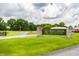 A welcoming sign for Pebble Brook Golf Club with a picturesque view of the course at 19009 Beverly Shones Ln, Noblesville, IN 46062