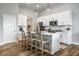 Bright kitchen with white cabinets, stainless steel appliances, and pendant lighting at 19009 Beverly Shones Ln, Noblesville, IN 46062