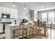 Open concept kitchen with white cabinetry and adjoining dining area at 19009 Beverly Shones Ln, Noblesville, IN 46062