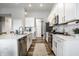 Modern kitchen featuring stainless steel appliances, white cabinets, and a subway tile backsplash at 19009 Beverly Shones Ln, Noblesville, IN 46062