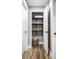 Open linen closet with towels, blankets, baskets and plant at 19009 Beverly Shones Ln, Noblesville, IN 46062