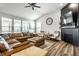 Bright living room features vaulted ceilings, modern ceiling fan, and a cozy fireplace at 19009 Beverly Shones Ln, Noblesville, IN 46062