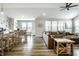 Open concept living room and dining area features modern flooring and abundant natural light at 19009 Beverly Shones Ln, Noblesville, IN 46062