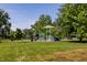 A vibrant community playground with colorful equipment set against a backdrop of mature trees at 19009 Beverly Shones Ln, Noblesville, IN 46062