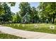 A vibrant playground with slides and swings set amidst a lush park-like setting, perfect for Gathering fun at 19009 Beverly Shones Ln, Noblesville, IN 46062