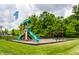 A colorful playground equipped with swings, slides, and a climbing structure at 19009 Beverly Shones Ln, Noblesville, IN 46062