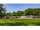 An inviting greenspace view of a train exhibit with vintage cars nestled in a serene, tree-lined setting at 19009 Beverly Shones Ln, Noblesville, IN 46062