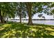 Scenic waterfront view with lush trees and inviting park benches, perfect for relaxation and reflection at 19009 Beverly Shones Ln, Noblesville, IN 46062