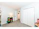 Neutral bedroom with closet, side table, and a colorful storage unit, great for and play at 20845 Summit Rd, Noblesville, IN 46062