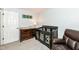Charming Bedroom featuring a crib, dresser with changing pad, and cozy reading chair for a comforting space at 20845 Summit Rd, Noblesville, IN 46062