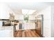 Bright kitchen featuring white cabinets, stainless steel appliances, and modern finishes at 20845 Summit Rd, Noblesville, IN 46062