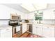 This well-lit kitchen offers stainless steel appliances, ample cabinet space, and modern finishes at 20845 Summit Rd, Noblesville, IN 46062