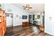 A spacious living room with wood floors and a ceiling fan and natural light coming from the window at 20845 Summit Rd, Noblesville, IN 46062