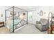 Stylish main bedroom with canopy bed, chair, plush carpet, and bright, airy feel at 20845 Summit Rd, Noblesville, IN 46062