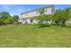 Expansive lawn of the backyard and back of the house with an outdoor patio space at 2096 Whitetail Ct, Avon, IN 46123