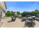 Backyard patio with outdoor seating, a grassy lawn and beautiful landscaping at 2096 Whitetail Ct, Avon, IN 46123