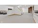 Finished basement area with stairs, seating area, white paint, and neutral floors at 2096 Whitetail Ct, Avon, IN 46123