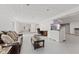 Finished basement includes neutral floors, recessed lighting, white walls, TV and leather furniture at 2096 Whitetail Ct, Avon, IN 46123