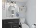 Stylish bathroom featuring a modern vanity, an oval mirror, and a toilet at 2096 Whitetail Ct, Avon, IN 46123