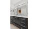 Bright bathroom features black vanity with a white countertop and shower-tub combination at 2096 Whitetail Ct, Avon, IN 46123