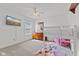 Bedroom featuring bunk beds, ceiling fan, a window and dresser with decor at 2096 Whitetail Ct, Avon, IN 46123