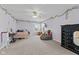 Large bedroom with neutral carpet, ceiling fan and beanbag, and light purple walls at 2096 Whitetail Ct, Avon, IN 46123