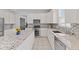 Bright kitchen features granite counters, stainless steel appliances, and tile backsplash at 2096 Whitetail Ct, Avon, IN 46123