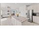 Open kitchen featuring white cabinets, stainless steel appliances, granite countertops, and a large island at 2096 Whitetail Ct, Avon, IN 46123
