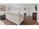 Cozy living room featuring a fireplace, hardwood floors, and large windows for natural light at 2096 Whitetail Ct, Avon, IN 46123