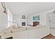 Comfortable living room features a fireplace and large windows for bright, natural light at 2096 Whitetail Ct, Avon, IN 46123