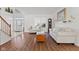 Spacious living room with hardwood floors, natural light, and view of the entry way at 2096 Whitetail Ct, Avon, IN 46123