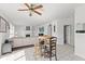 Comfortable living room with ceiling fan, fireplace, and bright light from the outside at 2096 Whitetail Ct, Avon, IN 46123