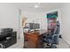 Spacious home office with large desk, natural light, and views to staircase at 2096 Whitetail Ct, Avon, IN 46123
