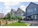 Backyard featuring a well-maintained lawn, privacy fence, and a patio with outdoor seating area at 2140 Alabama St, Indianapolis, IN 46202