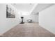 Finished basement area featuring neutral carpet and bright white walls perfect for an office or recreation space at 2140 Alabama St, Indianapolis, IN 46202