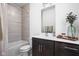 Bathroom with modern vanity, bathtub, and shower combo at 2140 Alabama St, Indianapolis, IN 46202