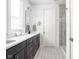 Tastefully designed bathroom with modern fixtures, tile flooring, and a shower with glass door at 2140 Alabama St, Indianapolis, IN 46202