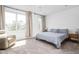 Bright bedroom featuring neutral walls, plush carpet, large windows, and stylish furnishings at 2140 Alabama St, Indianapolis, IN 46202